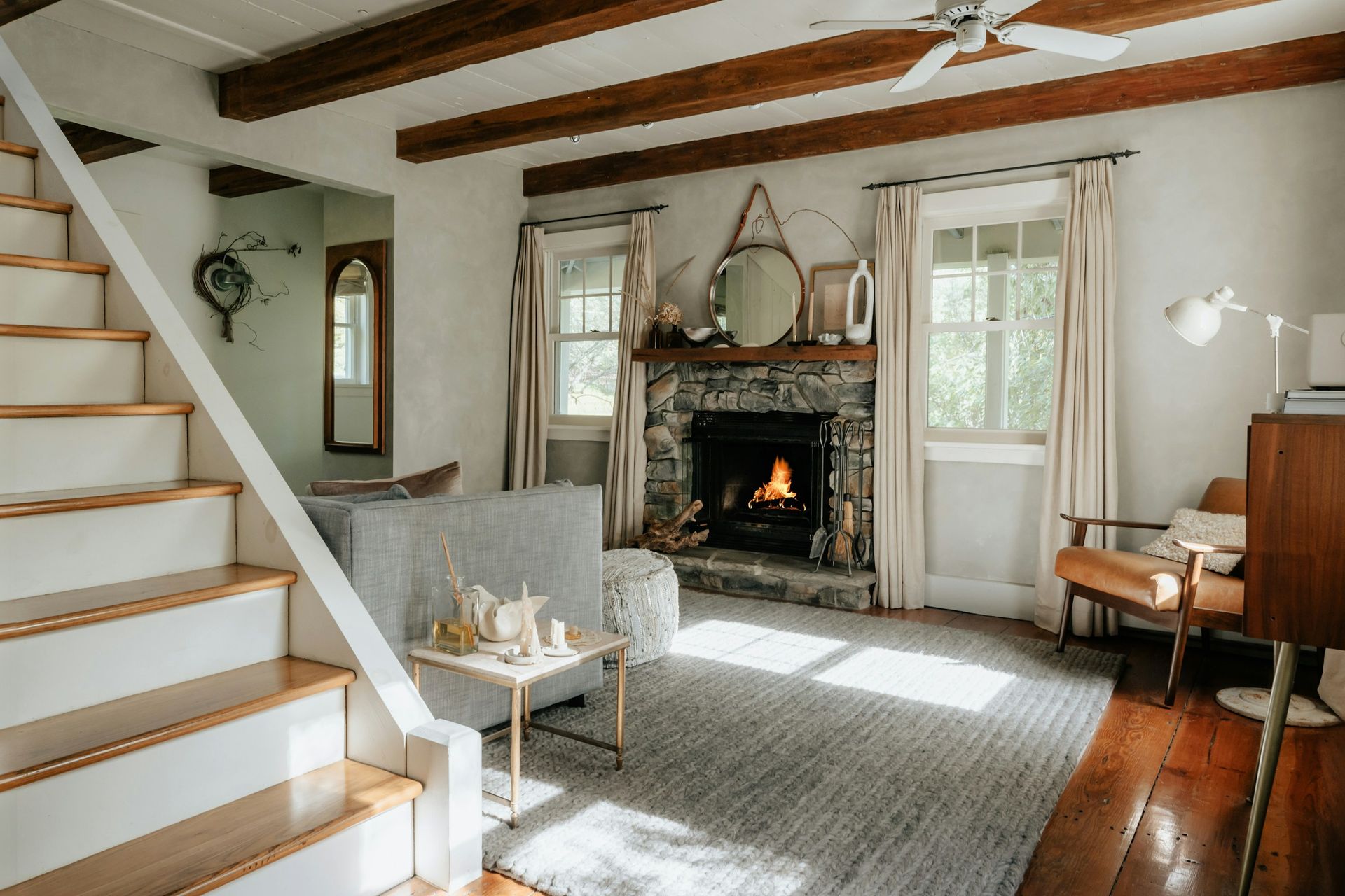 Bright living room with a stone fireplace