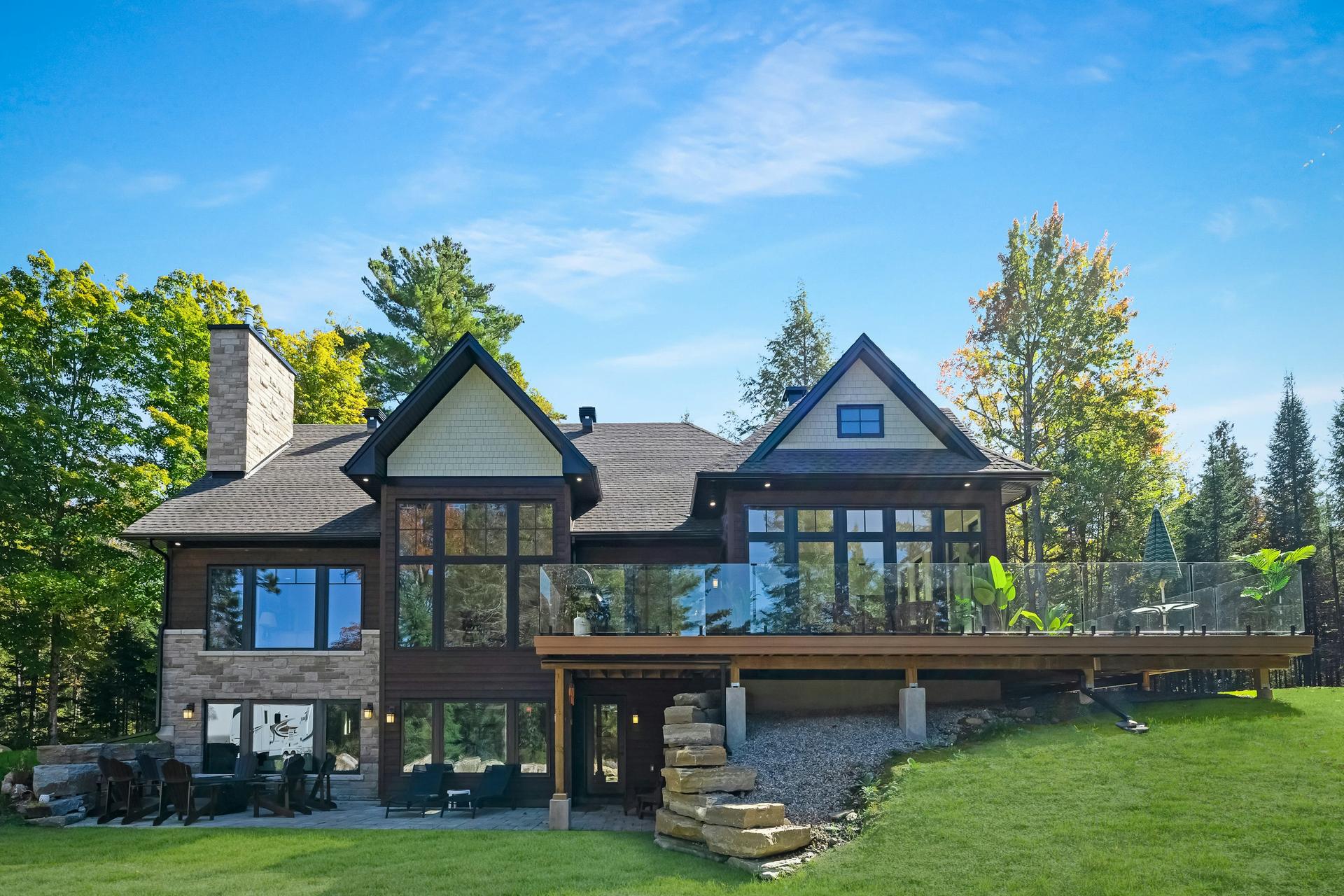 Modern stone-and-timber house with a deck