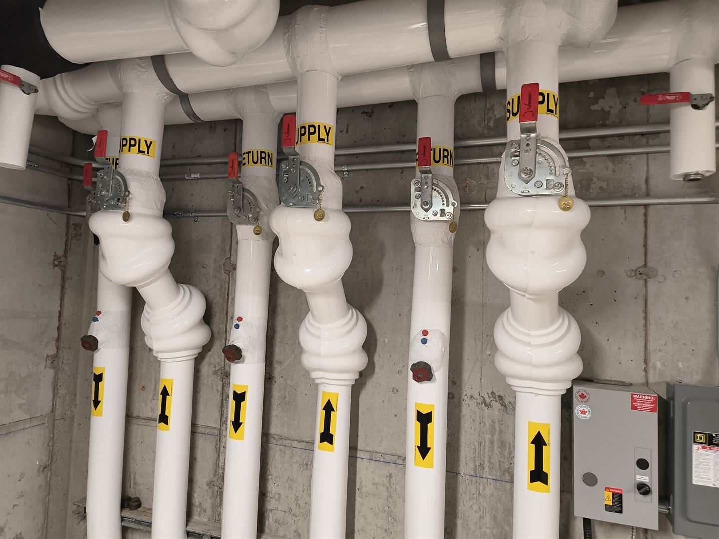 Large insulated mains in a plant room.