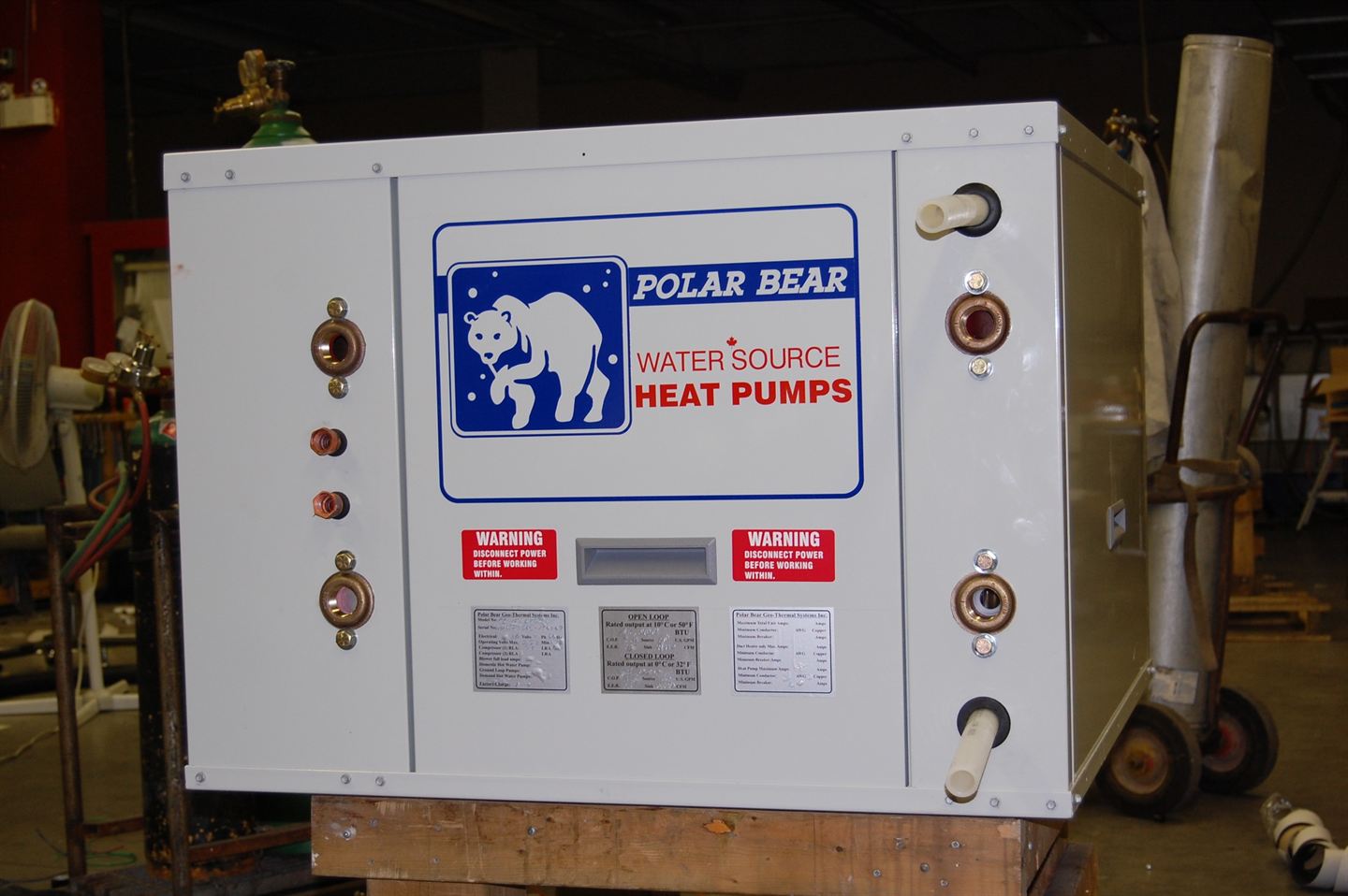 White Polar Bear cabinet with badge on a pallet.